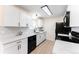 Contemporary kitchen with modern appliances, quartz countertops, and ample cabinet space at 8271 Bluebell Way, Denver, CO 80221