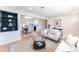 Bright living room seamlessly connects to a dining area with elegant decor at 8271 Bluebell Way, Denver, CO 80221