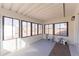 Sunroom offering tons of natural light, lots of windows, and views of the backyard at 8271 Bluebell Way, Denver, CO 80221