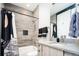 Stylish bathroom features a shower-tub combo with modern fixtures and a floating vanity at 1323 Elati St # 3, Denver, CO 80204