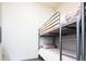 Bedroom featuring a metal bunk bed, providing a functional and space-saving sleeping arrangement at 1323 Elati St # 3, Denver, CO 80204