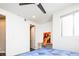 Bright bedroom with minimalist design features a modern light fixture and abstract art at 1323 Elati St # 3, Denver, CO 80204