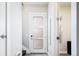 Bright entryway featuring tiled floors, stairs, and a frosted glass door leading to additional rooms at 1323 Elati St # 3, Denver, CO 80204