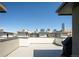 Spacious rooftop deck with downtown views, perfect for entertaining and relaxation at 1323 Elati St # 3, Denver, CO 80204