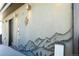 Rooftop deck features a unique desert mural and modern lighting fixtures at 1323 Elati St # 3, Denver, CO 80204
