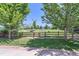 Scenic backyard featuring well-maintained wooden fence and a lush green lawn for outdoor enjoyment at 2312 Dogwood Dr, Erie, CO 80516