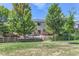 Large, fenced backyard with a patio, grill, and seating area, ideal for outdoor enjoyment at 2312 Dogwood Dr, Erie, CO 80516