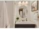 Bright bathroom with a vanity, stylish mirror, and decorative accents at 2312 Dogwood Dr, Erie, CO 80516