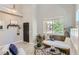Brightly lit room with daybed, decorative accessories, and neutral walls and flooring at 2312 Dogwood Dr, Erie, CO 80516