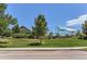 Community pool with a sun shade area and a large grassy section at 2312 Dogwood Dr, Erie, CO 80516