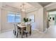 Dining room featuring modern lighting, neutral walls, and stylish decor at 2312 Dogwood Dr, Erie, CO 80516