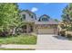 Beautiful two-story house with stone accents, well-maintained lawn, and an attached two-car garage at 2312 Dogwood Dr, Erie, CO 80516