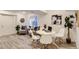 Cozy living area with wood flooring, modern decor and comfortable seating arrangement at 2312 Dogwood Dr, Erie, CO 80516