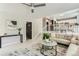 Bright living room featuring modern decor and an open floor plan to the dining and kitchen at 2312 Dogwood Dr, Erie, CO 80516