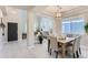 Open-concept area that adjoins dining area and showcases natural light and stylish decor at 2312 Dogwood Dr, Erie, CO 80516