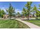 Community playground with climbing structures, swings, and a shaded picnic area for Gathering fun at 2312 Dogwood Dr, Erie, CO 80516
