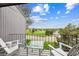 Relax on the balcony with its comfortable seating and scenic golf course view at 6515 Pinewood Dr, Parker, CO 80134