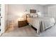Cozy bedroom featuring soft gray carpet, large bed, and ample natural light at 6515 Pinewood Dr, Parker, CO 80134