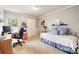 Bright bedroom featuring a desk, closet, and bed with blue accents and a decorative stained glass window at 6515 Pinewood Dr, Parker, CO 80134