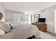 Comfortable bedroom with carpet, a queen bed, and a dresser with a large mirror at 6515 Pinewood Dr, Parker, CO 80134