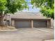 Two car garage with neutral paint color and well maintained landscaping at 6515 Pinewood Dr, Parker, CO 80134