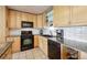 Bright kitchen with stainless steel appliances, granite countertops, and white subway tile backsplash at 6515 Pinewood Dr, Parker, CO 80134