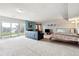 Open living room with fireplace, slider to the backyard, and potential for a combined living/sleeping space at 6515 Pinewood Dr, Parker, CO 80134