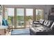 Bright living room with a comfortable sofa, balcony access, and stylish decor at 6515 Pinewood Dr, Parker, CO 80134