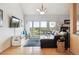 Bright living room with a comfortable sofa, balcony access, and stylish decor at 6515 Pinewood Dr, Parker, CO 80134