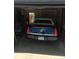 View into garage with black car at 102 Jackson Dr, Firestone, CO 80520