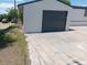 A one car garage with a concrete driveway at 102 Jackson Dr, Firestone, CO 80520