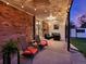 Relaxing backyard patio with outdoor seating, string lights, and easy access to the home's interior at 13935 E Idaho Pl, Aurora, CO 80012