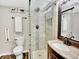 Modern bathroom with a glass-enclosed shower, elegant fixtures, and stylish decor at 13935 E Idaho Pl, Aurora, CO 80012