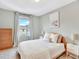 Light-filled bedroom features a large window and calm paint, creating a peaceful atmosphere at 13935 E Idaho Pl, Aurora, CO 80012