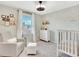 Cozy Bedroom features a comfortable chair, ottoman, and charming decor at 13935 E Idaho Pl, Aurora, CO 80012