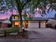 Charming two-story home with lush front yard, brick accents, and a spacious three-car garage at 13935 E Idaho Pl, Aurora, CO 80012