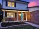 Inviting front of the house with a beautiful brick facade, well-manicured garden, and a welcoming entryway at 13935 E Idaho Pl, Aurora, CO 80012