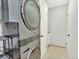 Convenient laundry area with new stackable washer and dryer with modern grey finish at 13935 E Idaho Pl, Aurora, CO 80012
