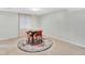 The comfortable carpeted living room features a rug, table and four chairs at 13935 E Idaho Pl, Aurora, CO 80012