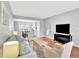 Comfortable living room featuring hardwood floors, neutral paint, and a dining area at 13935 E Idaho Pl, Aurora, CO 80012