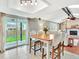 Inviting open-concept living space featuring a dining table and chairs that lead to a cozy living room at 13935 E Idaho Pl, Aurora, CO 80012