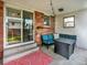 Inviting patio with brick accents, outdoor seating, and a cozy fire pit at 13935 E Idaho Pl, Aurora, CO 80012