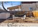 Cozy backyard setting with seating area, hammock, and shed against a wooden fence at 279 Delaware St, Denver, CO 80223