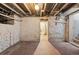 Unfinished basement featuring exposed brick walls and open layout at 279 Delaware St, Denver, CO 80223