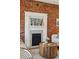 Close-up of the living room fireplace that shows a mantlepiece with decor at 279 Delaware St, Denver, CO 80223
