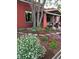 Lush landscaping in front yard with vibrant flowers and stone pathway at 279 Delaware St, Denver, CO 80223