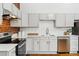 Well-equipped kitchen featuring stainless steel appliances and classic hardware at 279 Delaware St, Denver, CO 80223