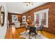 Inviting living room with exposed brick walls, hardwood floors, and stylish contemporary furnishings at 279 Delaware St, Denver, CO 80223