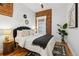 Comfortable bedroom featuring warm colors and a brick accent wall at 279 Delaware St, Denver, CO 80223