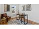 Bright office space with hardwood floors, modern desk and large window at 279 Delaware St, Denver, CO 80223